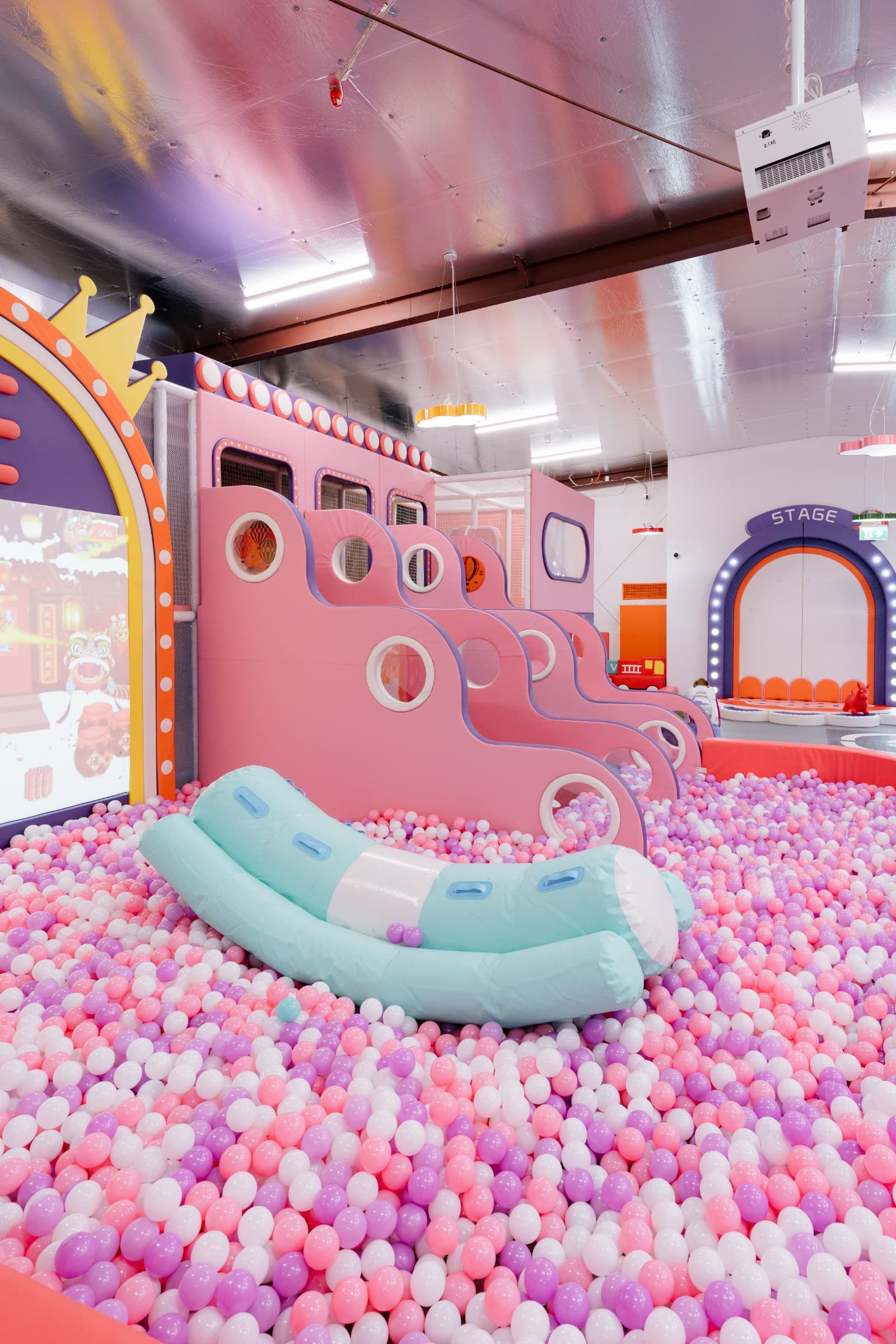 Comfortable cafe seating with sightlines into the play area for supervising adults.