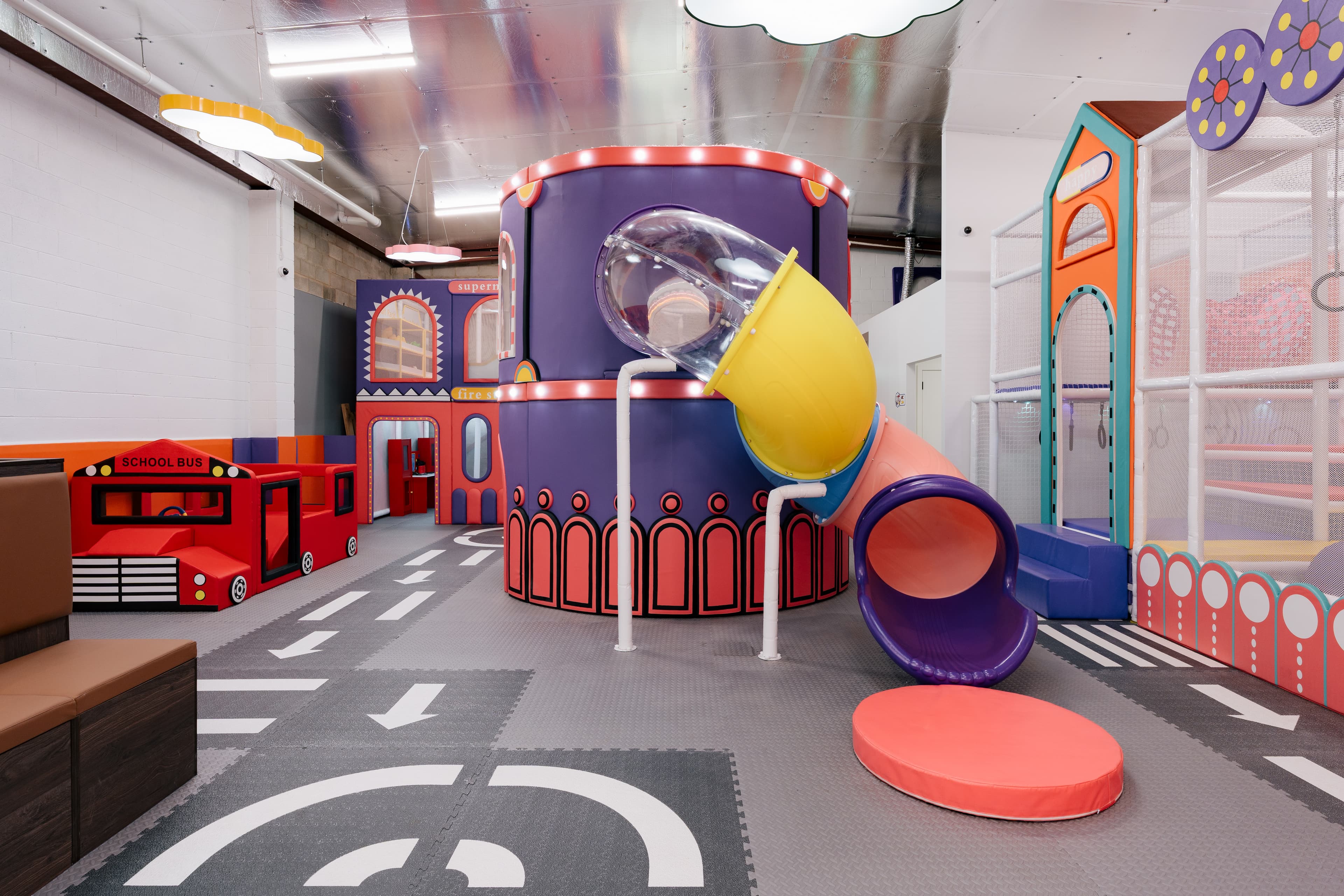 A miniature pretend-play town with charming little shopfronts and pastel storytelling details.